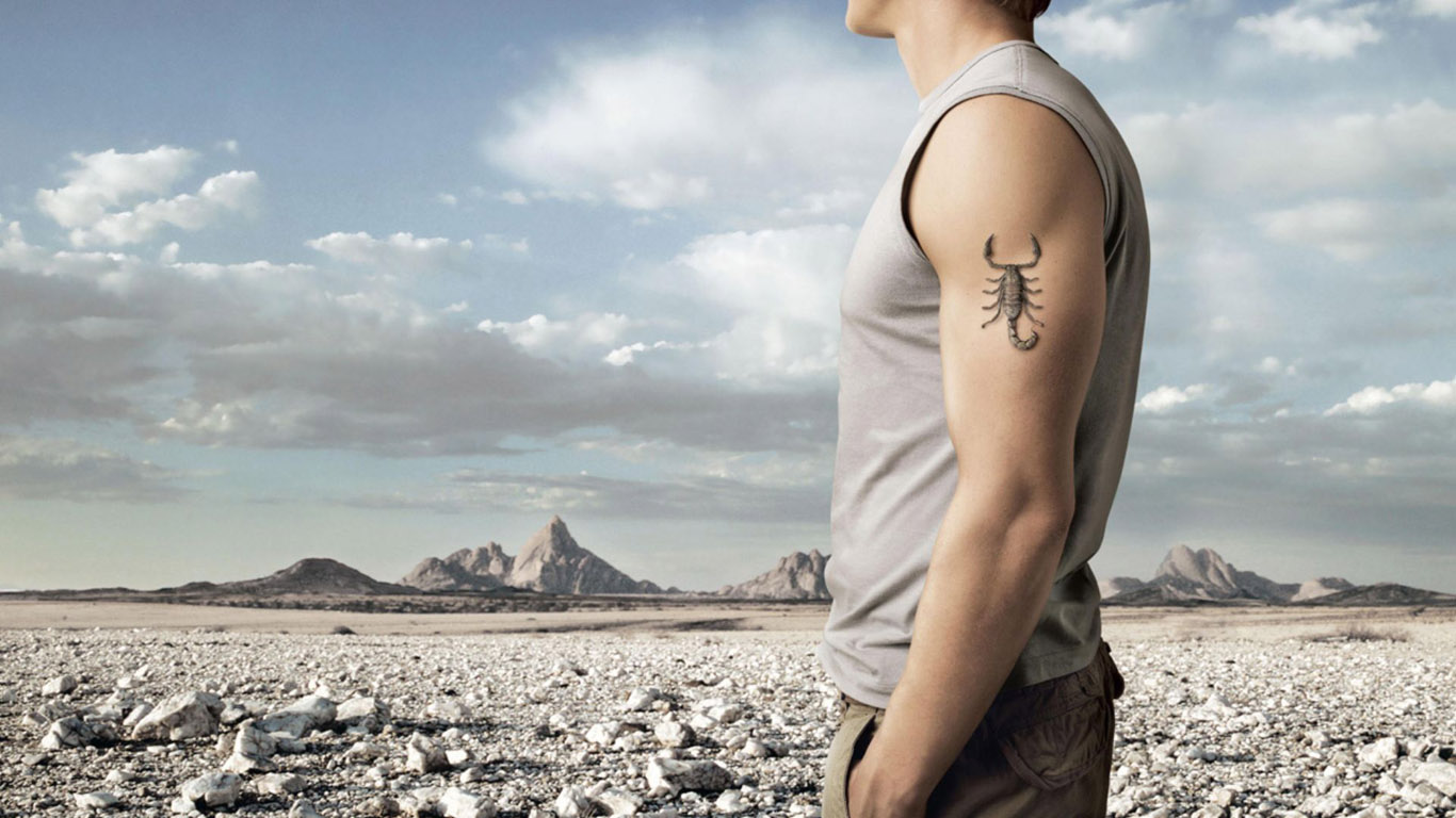 Фото мужских татуировок на спине, руке, предплечье, шее